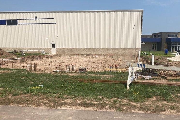 Construction begins on Dramm's new research greenhouse